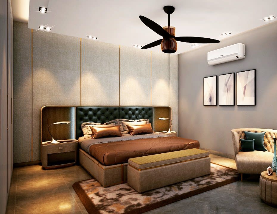Luxury basement bedroom with tufted headboard, elegant decor, and modern ceiling fan.